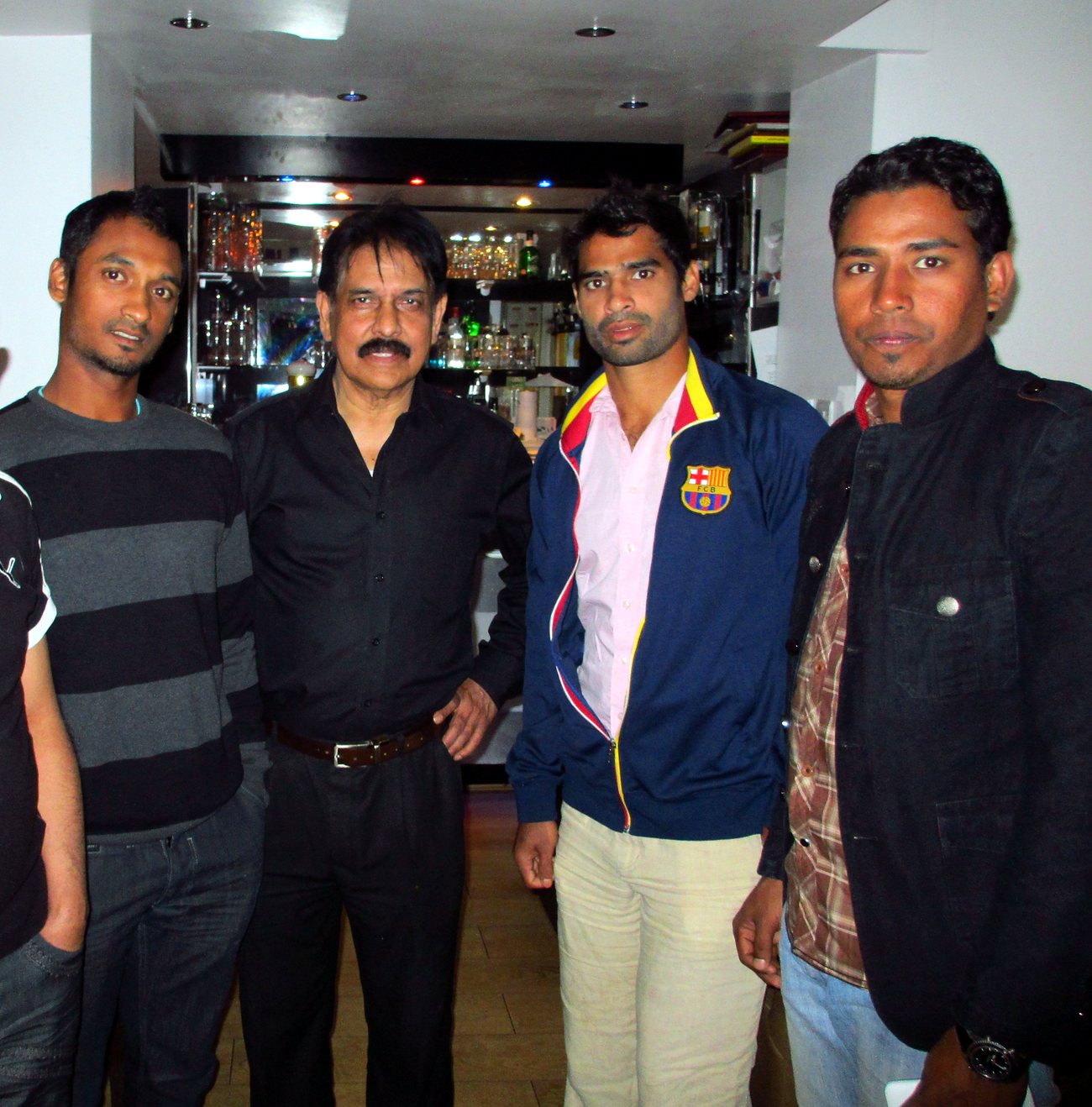 Sabbir Hossain at the bar of The Balti House with three members of the Bangladesh cricket squad